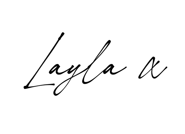 A black cursive script reading 'Layla x' centered on a plain white background.